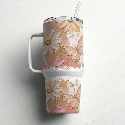 White tumbler with textured floral and butterfly design and a straw.