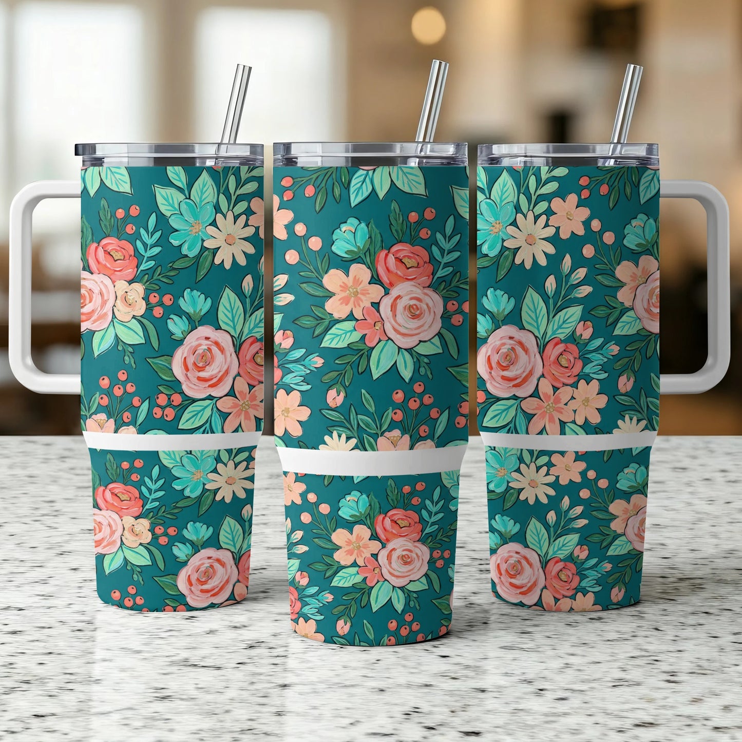 Three teal tumblers with a floral pattern, each with a white handle and straw.