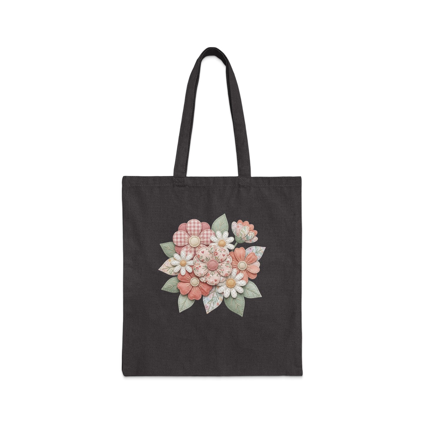 Dark tote bag with a floral appliqué featuring pink and white flowers.