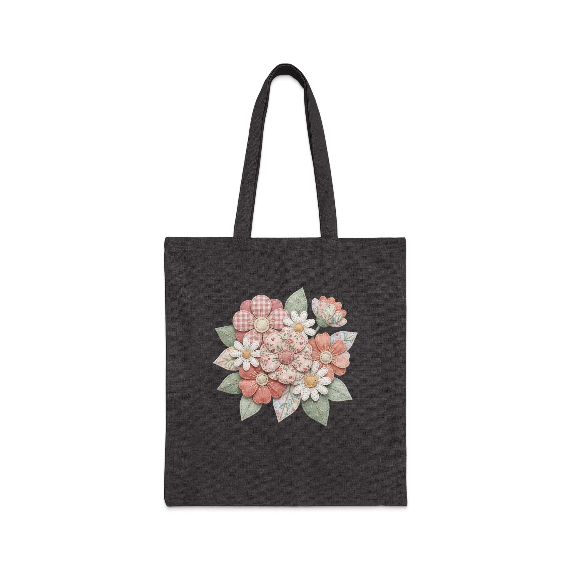 Dark tote bag with a floral appliqué featuring pink and white flowers.