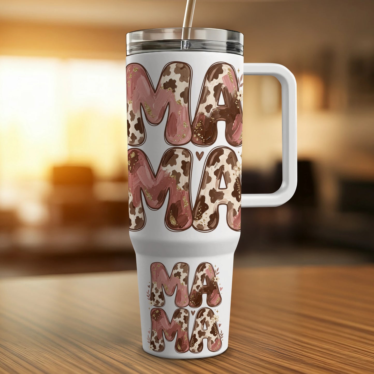 White tumbler with "Mama" repeated in cow print and glitter.