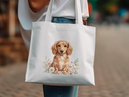 White tote bag with a watercolor dachshund illustration surrounded by flowers.