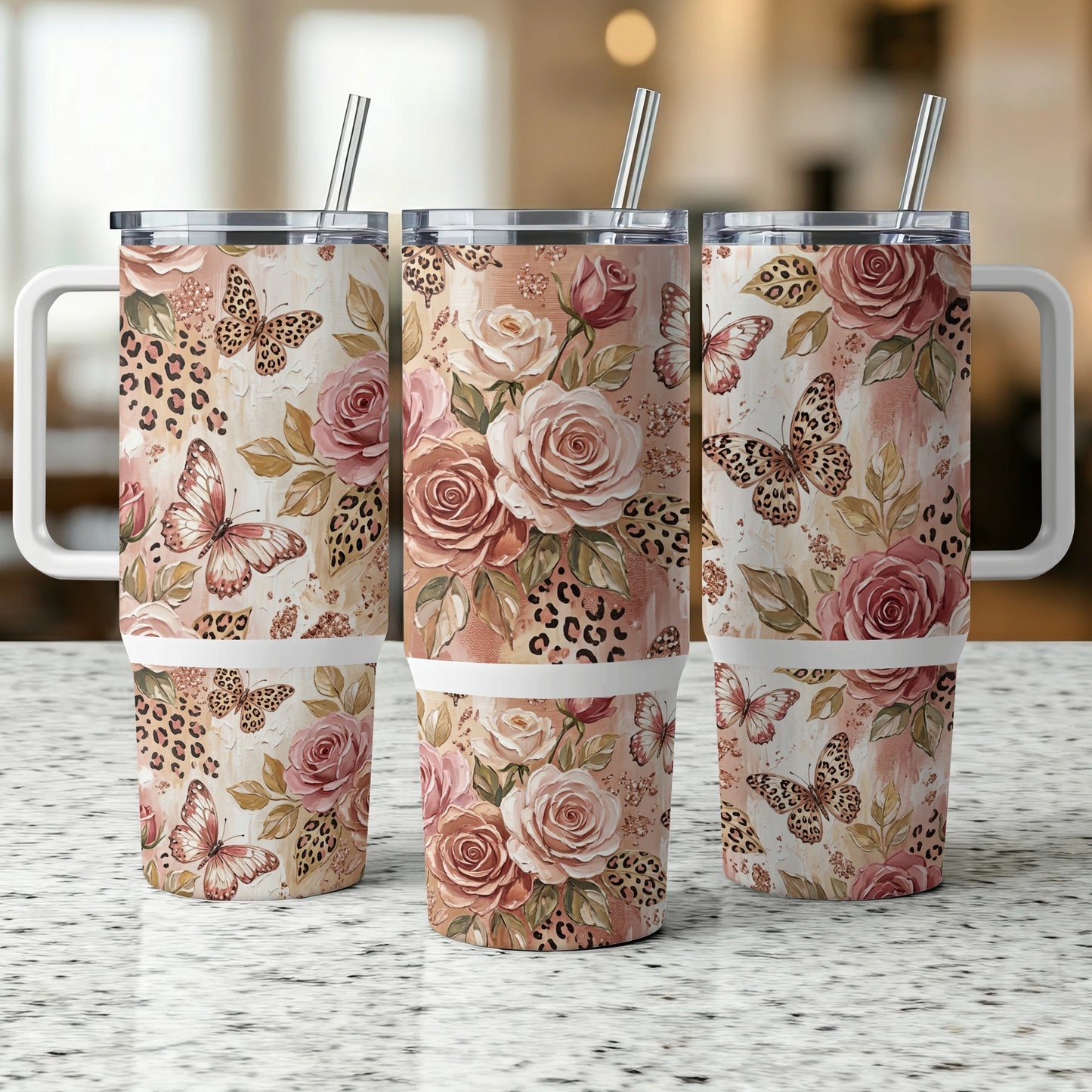 Three tumblers with roses, butterflies, and leopard print patterns.