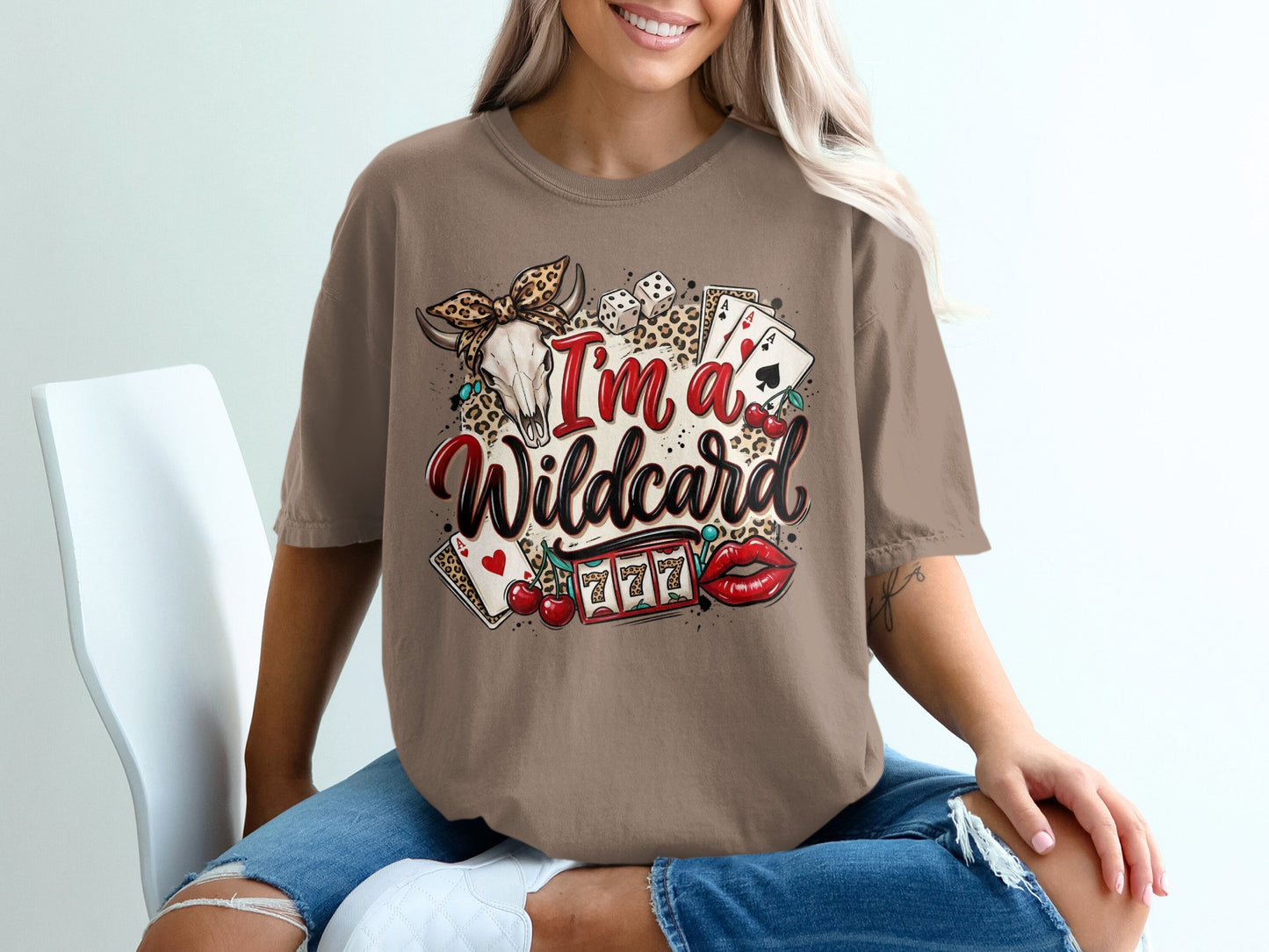 Brown t-shirt with "I'm a wildcard" design featuring skull, cards, cherries, and slot machine.
