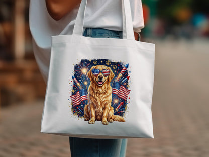 Golden retriever wearing heart-shaped sunglasses with fireworks and American flags on a white tote bag.