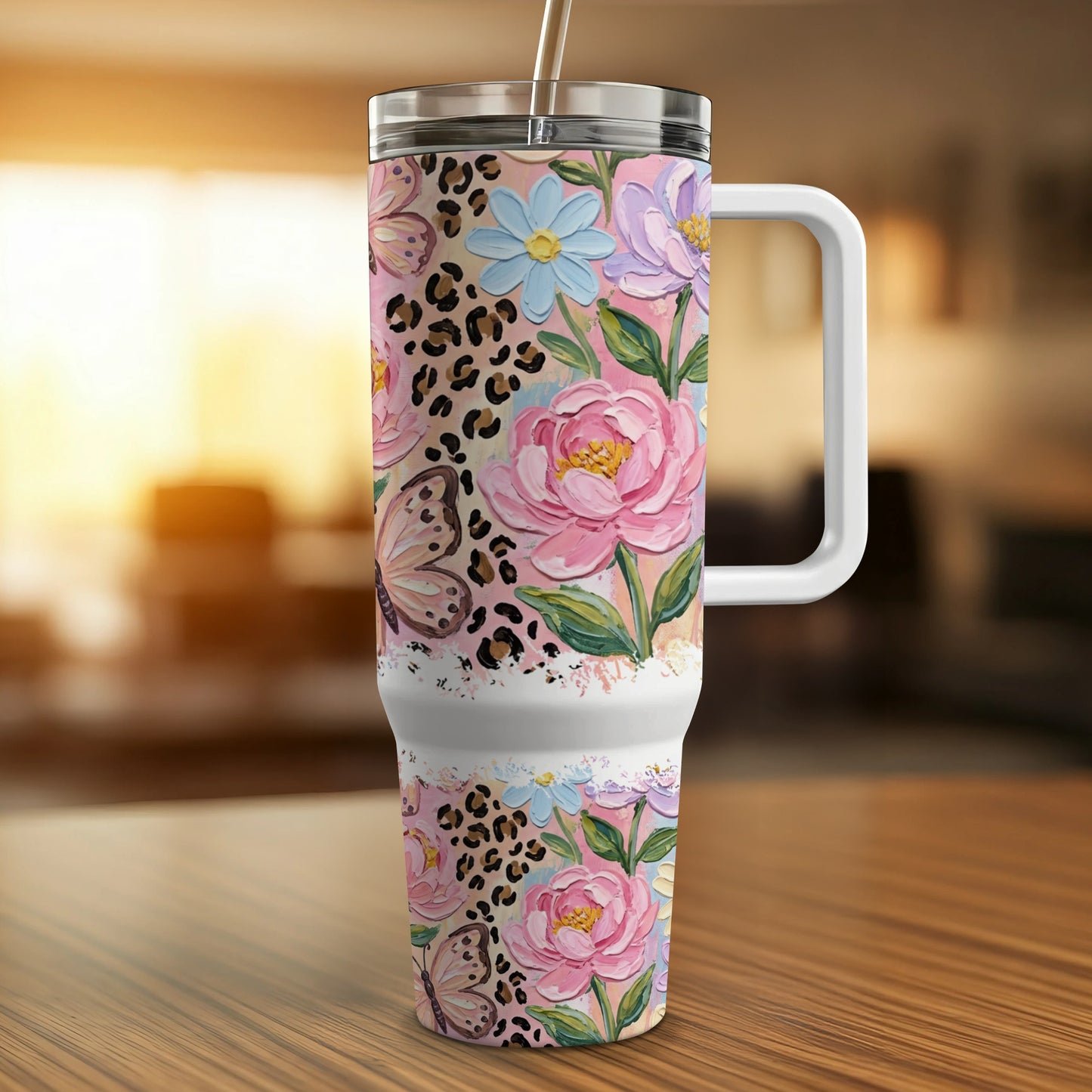 Tumbler with pink flowers, blue flowers, and leopard print.