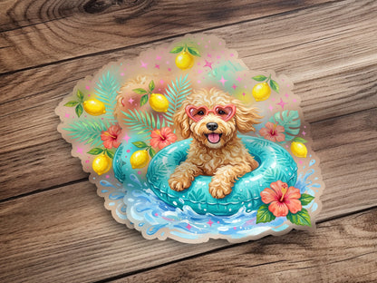 Fluffy poodle in inner tube wearing heart sunglasses, surrounded by lemons and hibiscus flowers.