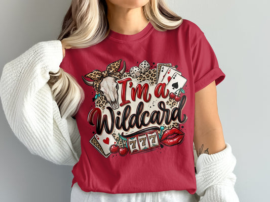 Red t-shirt with "I'm a Wildcard" text, skull, dice, cherries, and slot machine.