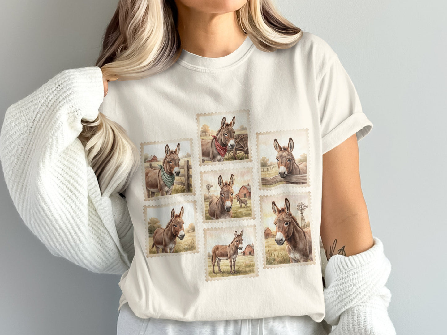 T-shirt with seven postage stamp designs of donkeys in rustic settings.