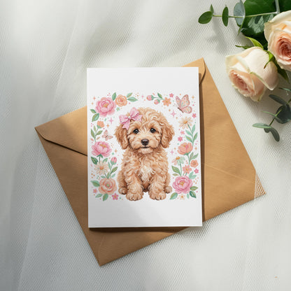 Card with fluffy golden puppy surrounded by flowers and butterflies.