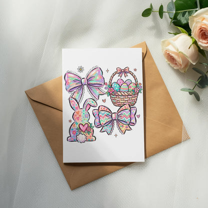 Card with pastel Easter bows, bunny, and egg-filled basket on brown envelope.