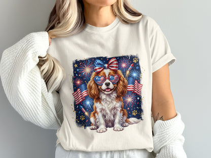 Cavalier King Charles Spaniel in sunglasses with fireworks and American flags.