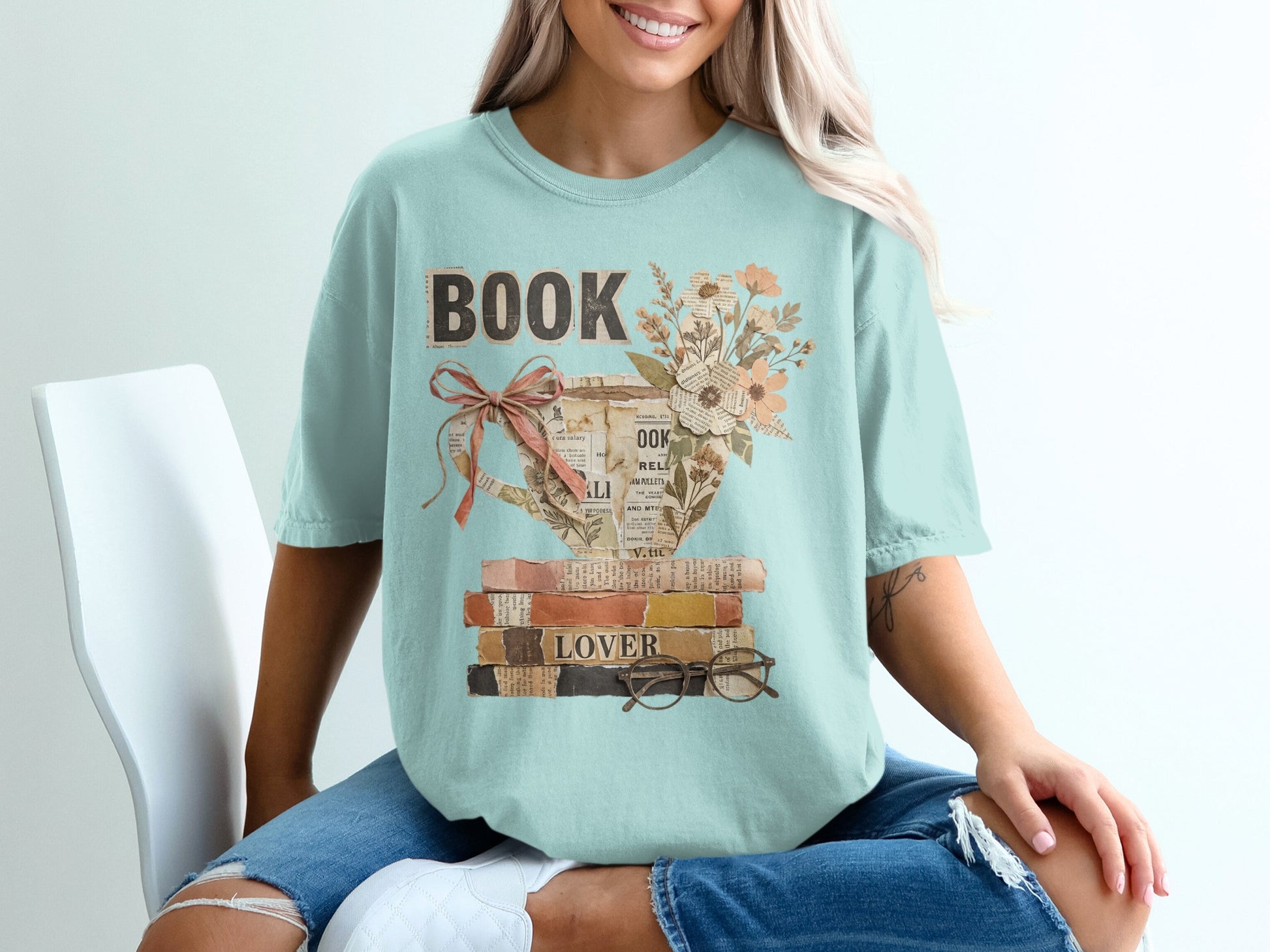 Light blue t-shirt with "BOOK LOVER" text and a teacup of flowers.