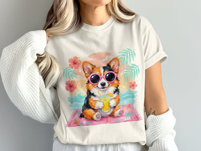 Corgi wearing sunglasses drinks from a cup on a beach mat.