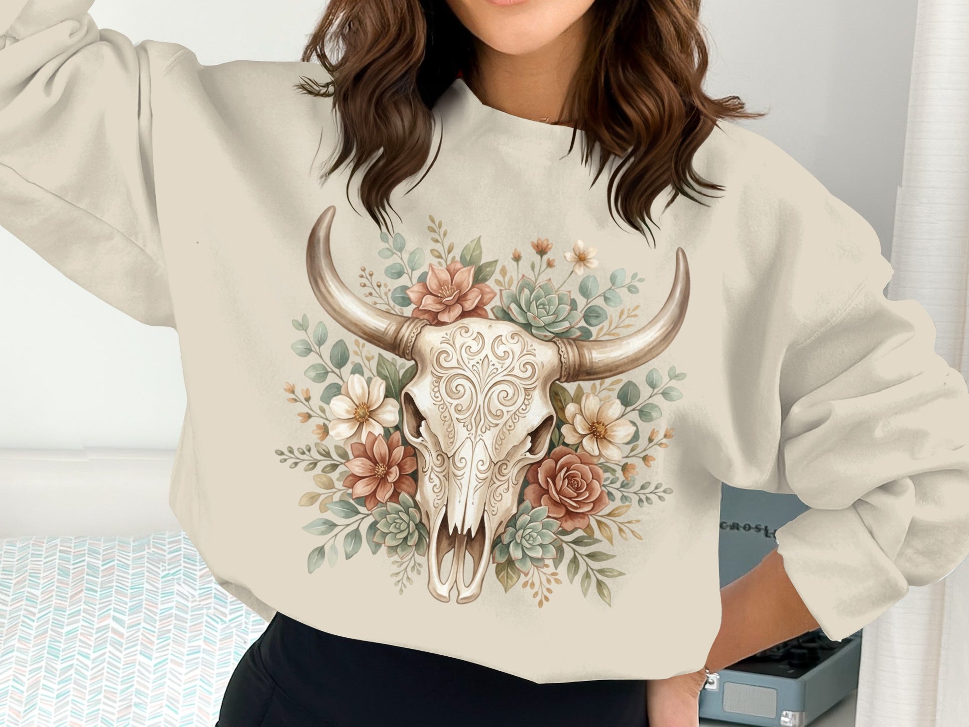 Cream sweatshirt with a floral bull skull graphic.