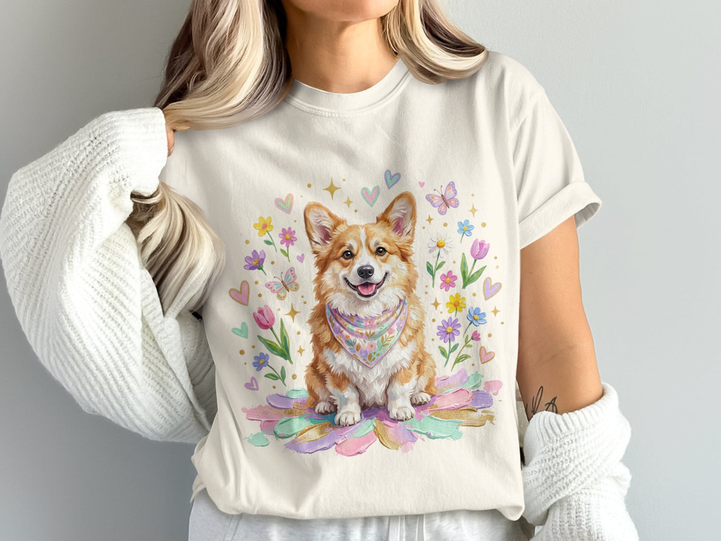 Corgi wearing a bandana sits among watercolor flowers and hearts.