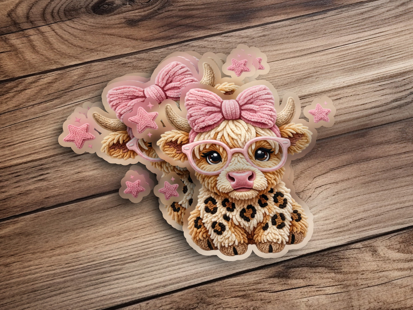 Cow sticker with pink bow, glasses, and leopard print details.