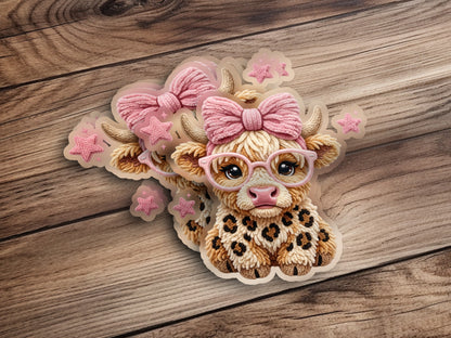 Cow sticker with pink bow, glasses, and leopard print details.