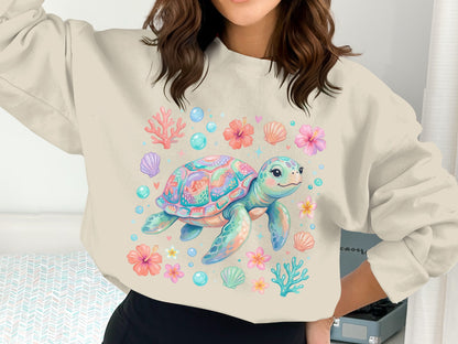 Sweatshirt with a colorful cartoon sea turtle surrounded by seashells and flowers.