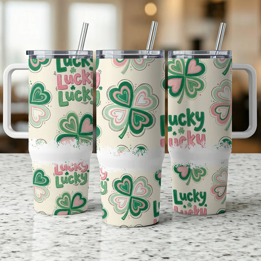 Three tumblers with shamrocks and "Lucky" text in pink and green.