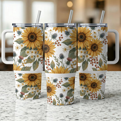 Three tumblers with a sunflower and floral pattern, featuring white handles and straws.