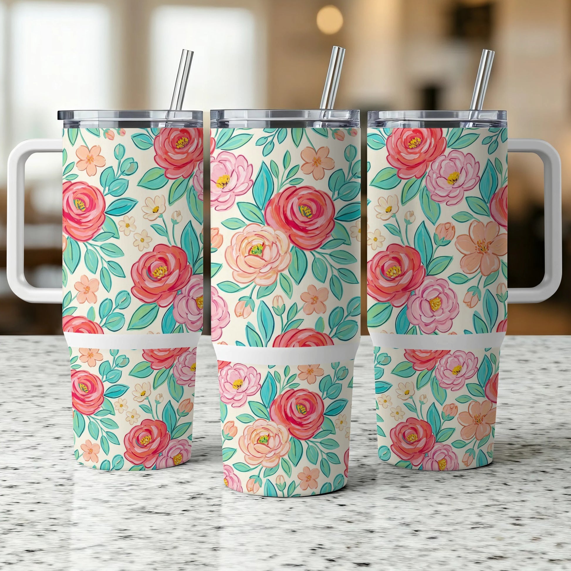 Three tumblers with a floral pattern featuring pink roses and green leaves.