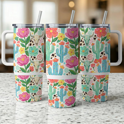 Three tumblers with a desert floral and skull pattern, featuring cacti and colorful flowers.