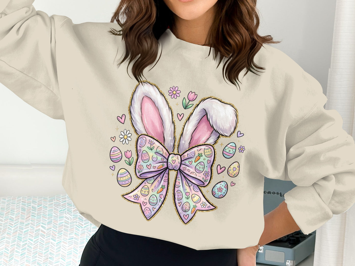 Cream sweatshirt with Easter bunny ears, pastel eggs, and floral graphics.