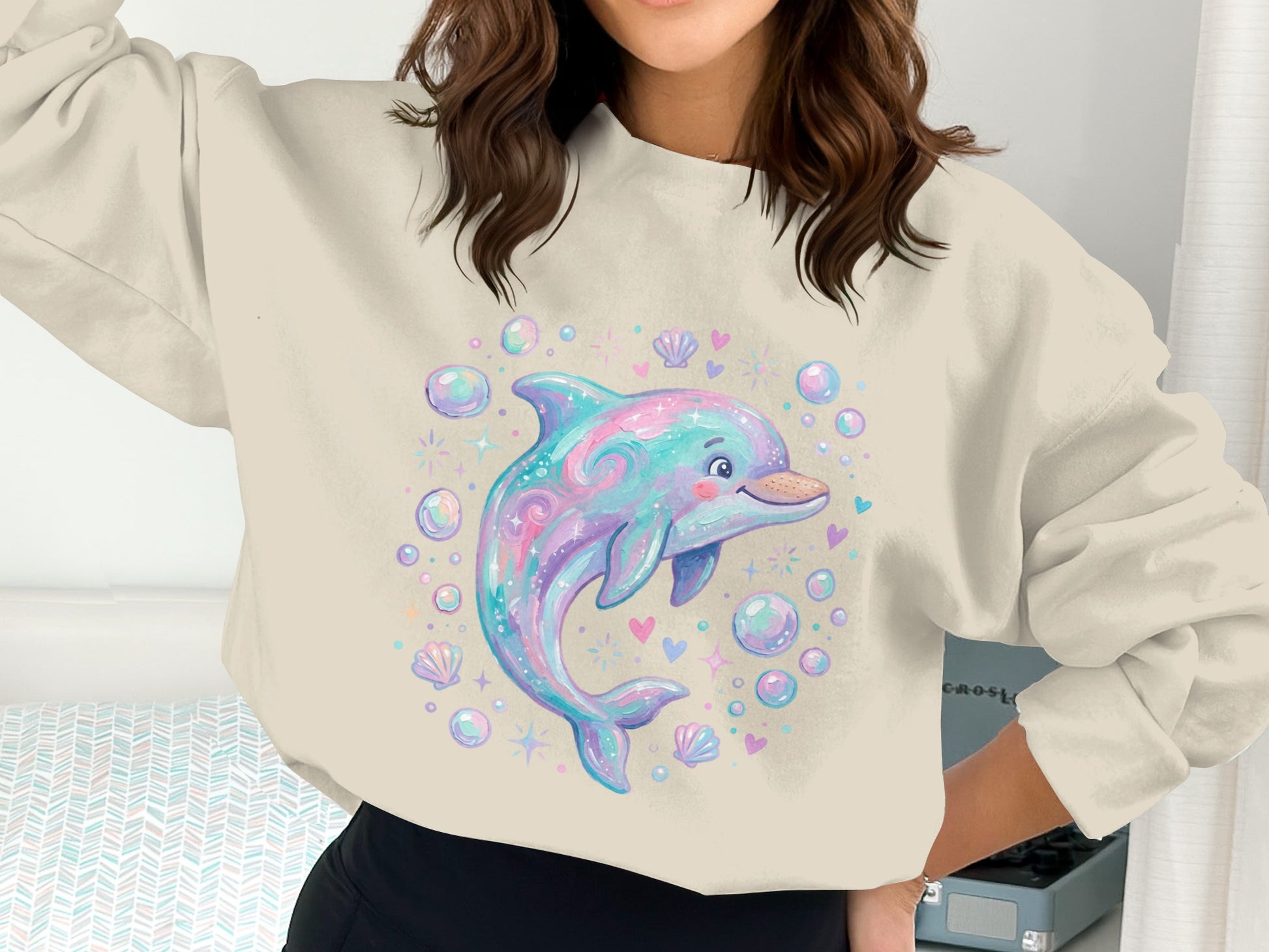 Sweatshirt with cartoon dolphin, bubbles, and seashells design.