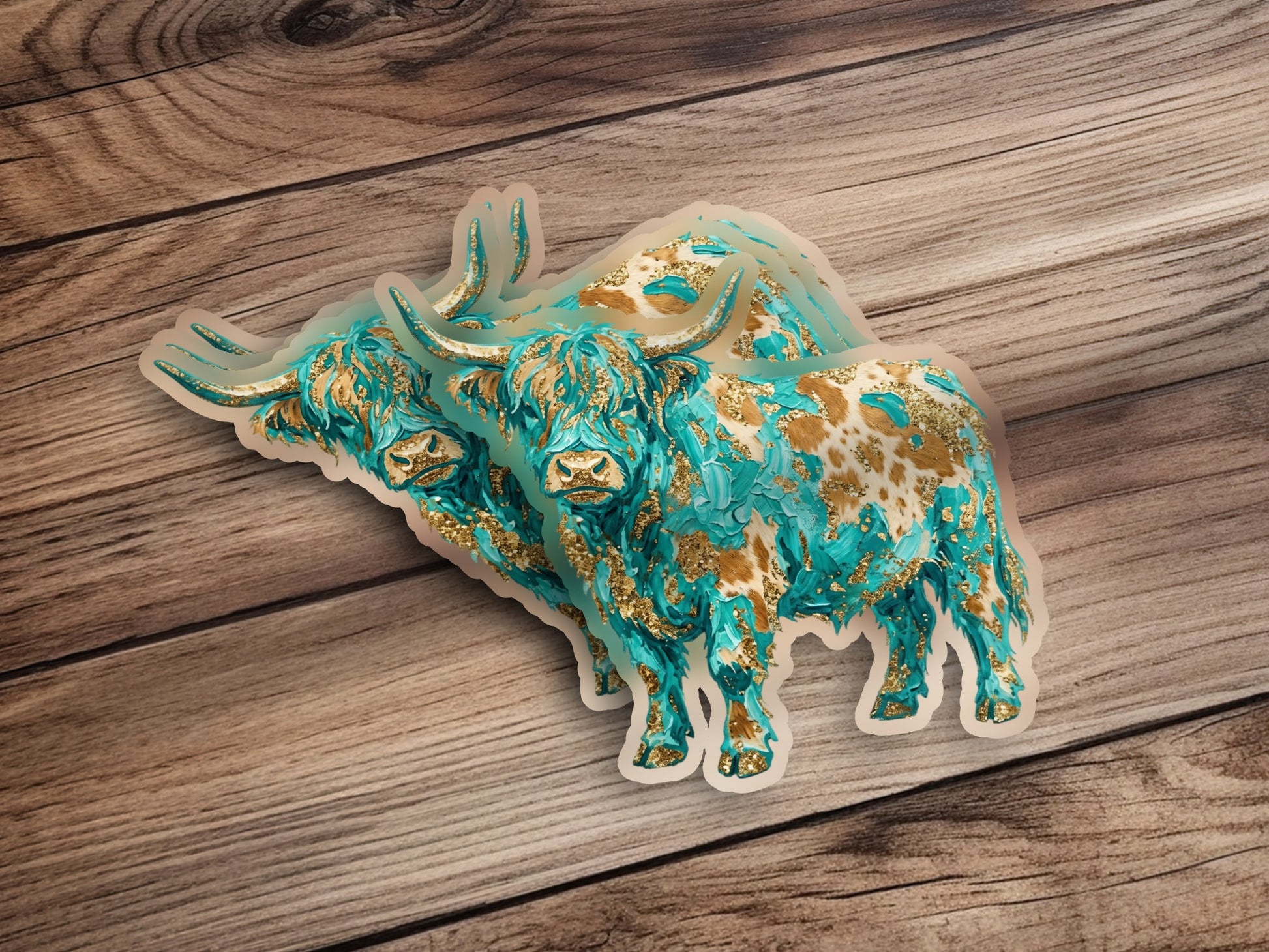 Two abstract highland cow stickers with turquoise and gold textured designs.