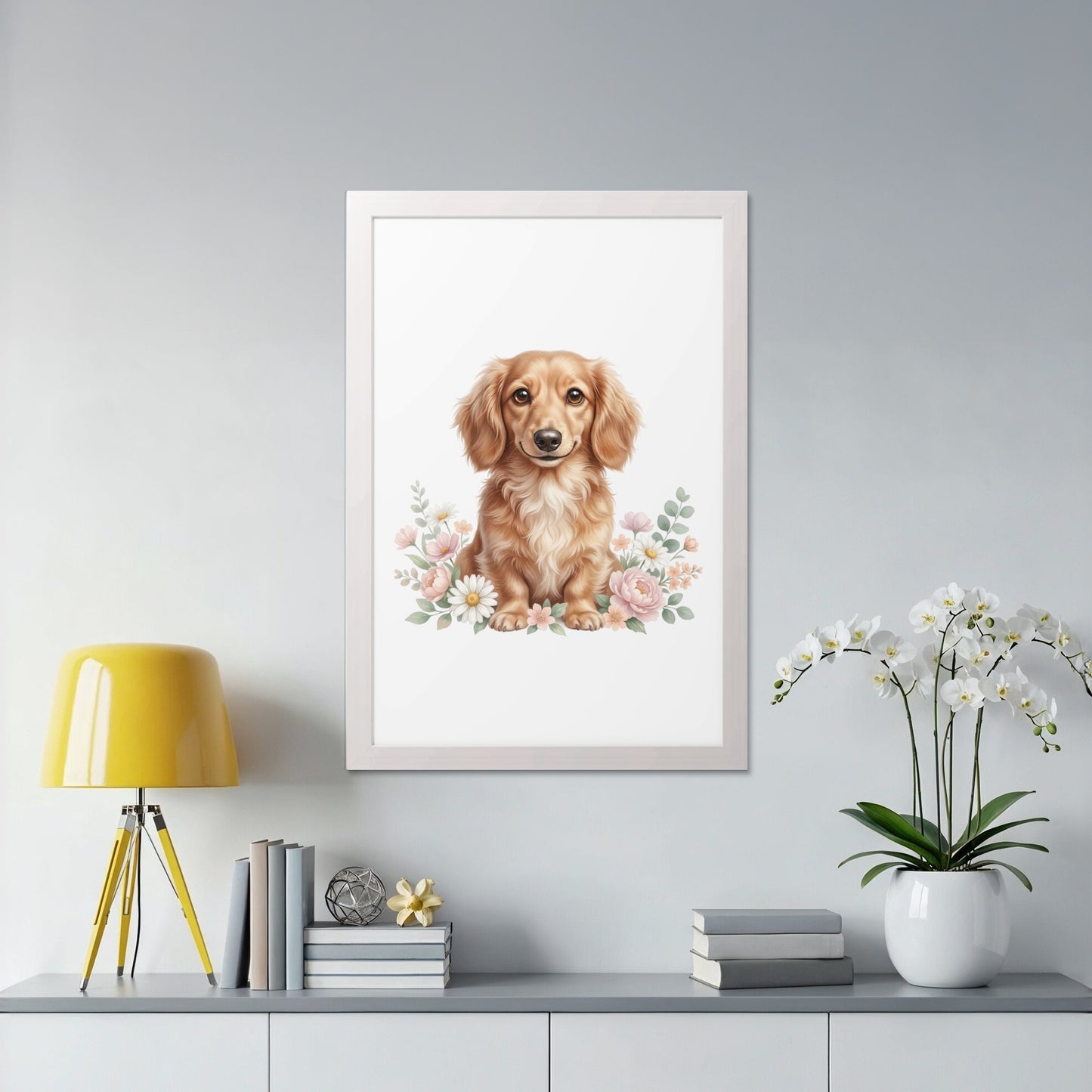 Dachshund puppy with flowers in a white frame.