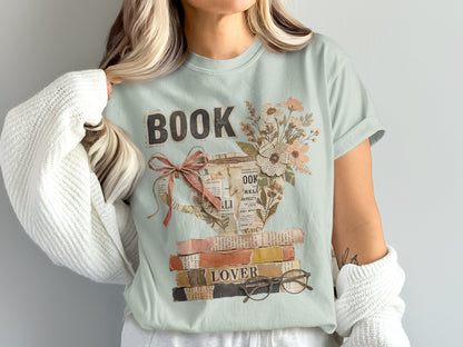 Light green t-shirt with stacked books and floral "BOOK LOVER" design.