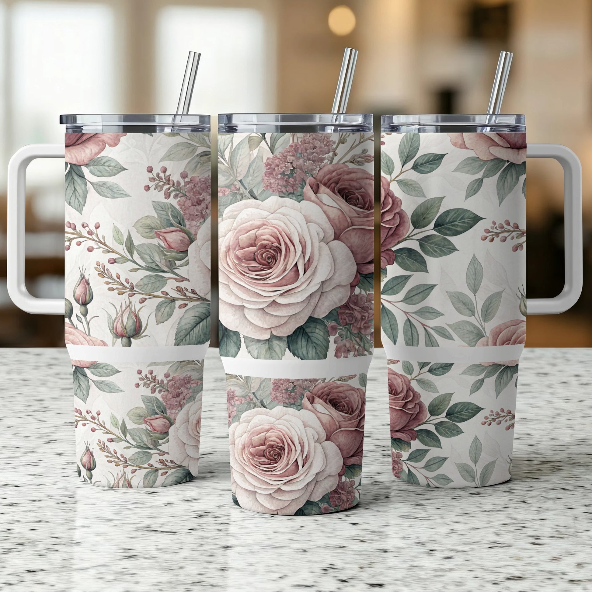 Three tumblers with a floral pattern of pink roses and green leaves.