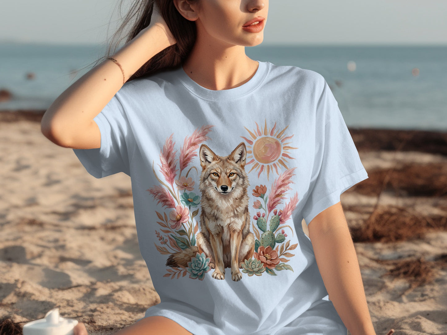 Light blue t-shirt with a coyote, cactus, and sun graphic design.