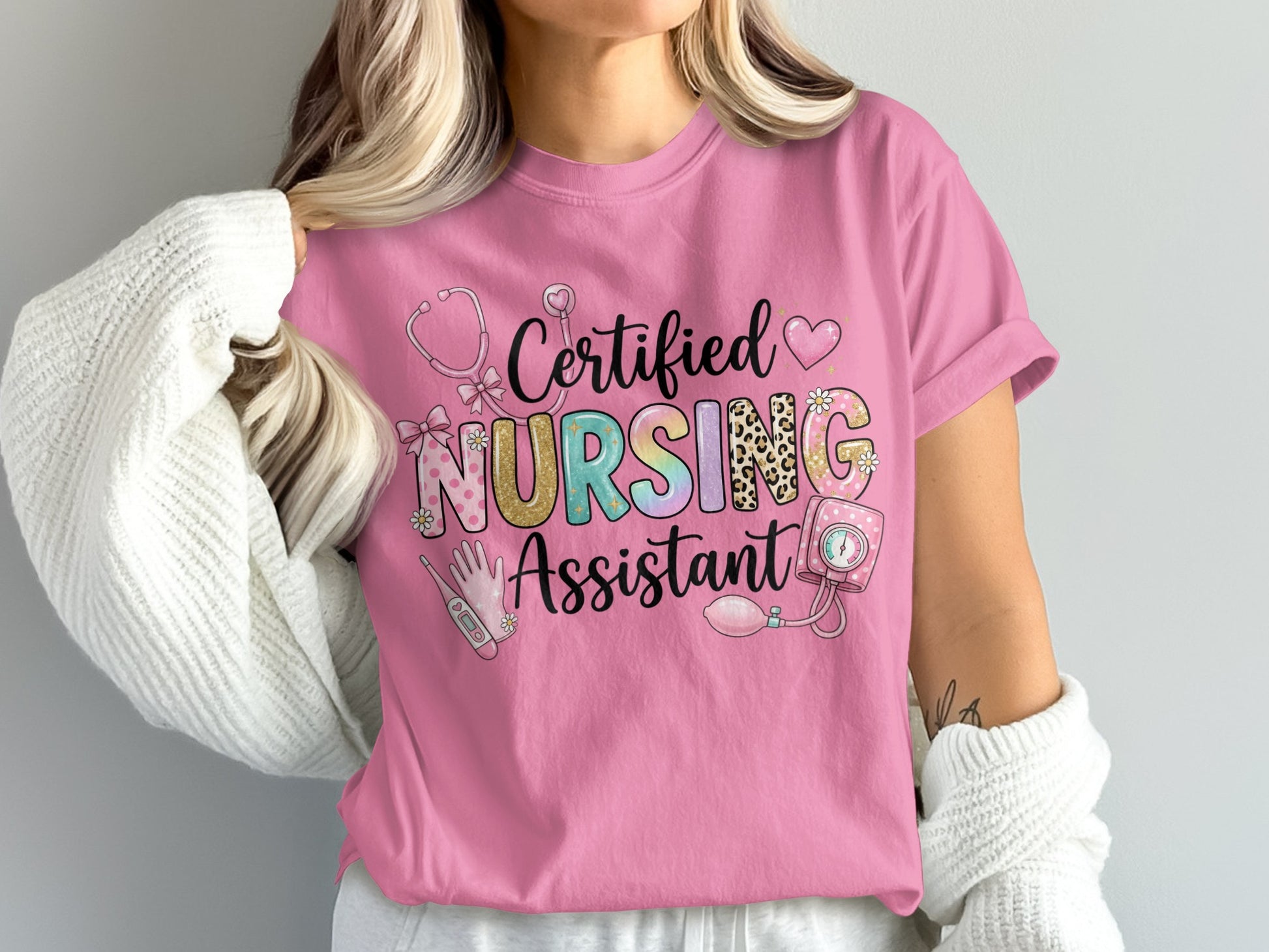 Pink t-shirt with "Certified Nursing Assistant" text and medical icons.