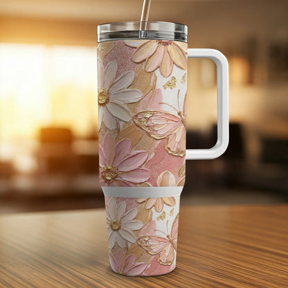 Pink and cream floral and butterfly textured tumbler with handle.