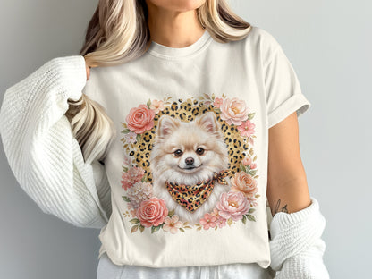 Pomeranian dog with floral border and bandana on cream t-shirt.