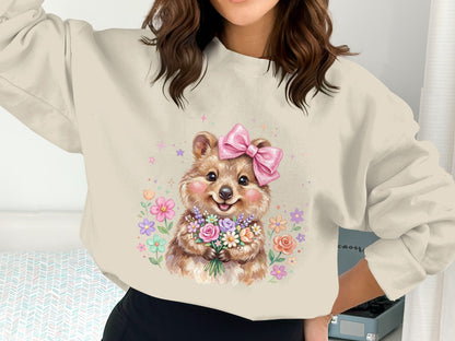 Quokka wearing a pink bow, holding a bouquet of colorful flowers.