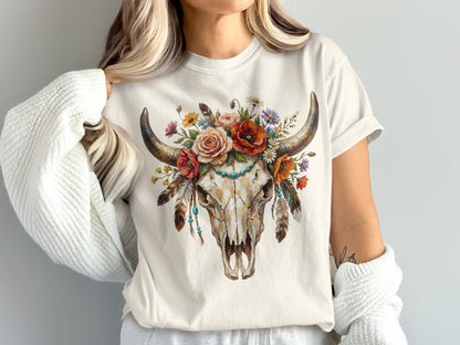 Cream t-shirt with a floral adorned bull skull graphic and turquoise beads.