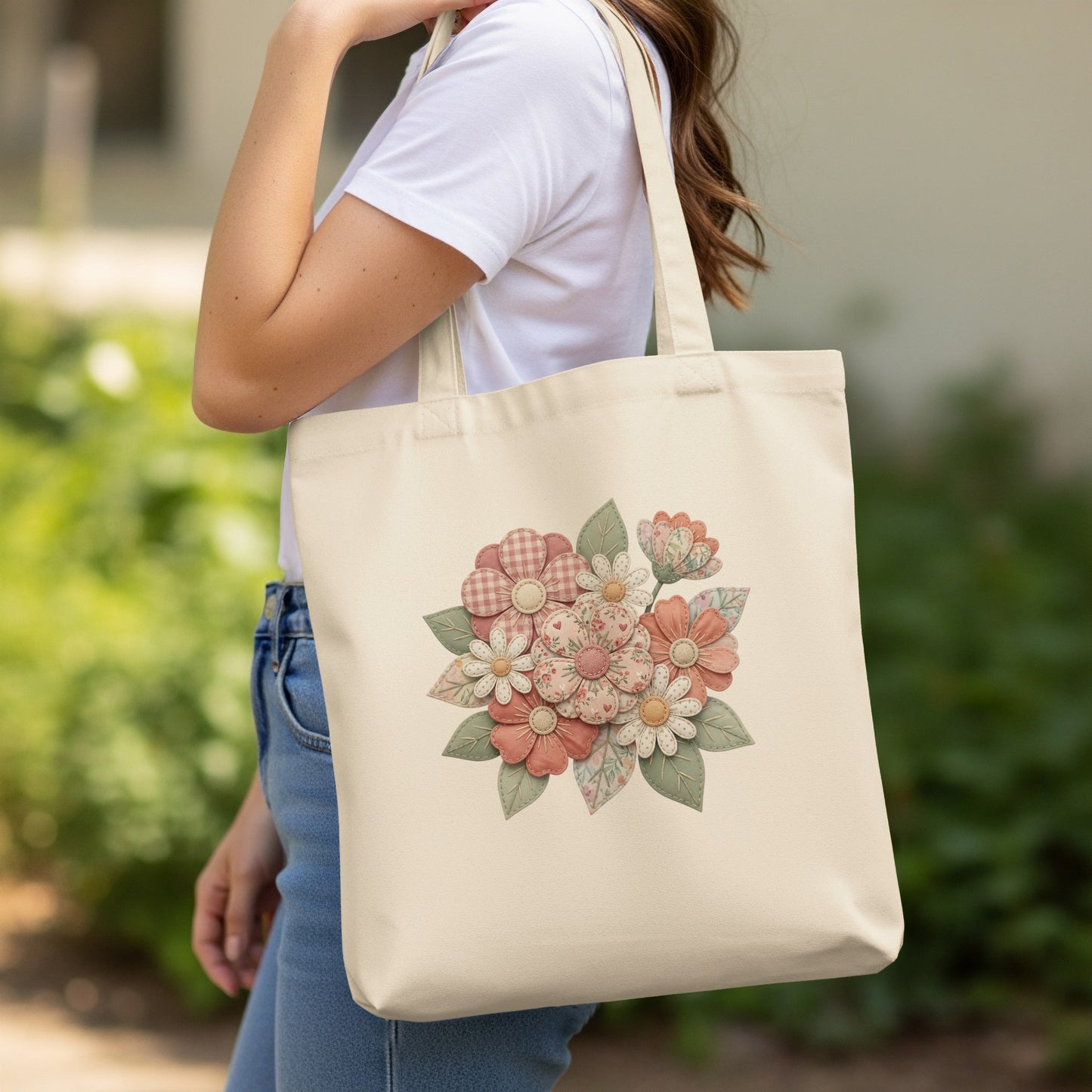 Cream tote bag with floral patchwork design featuring pink and tan flowers.