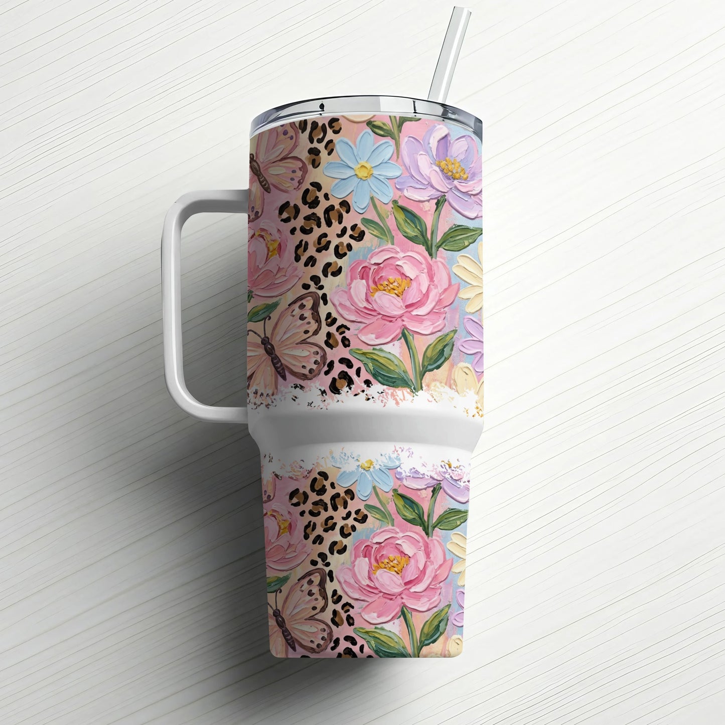 Pink floral and leopard print tumbler with straw.