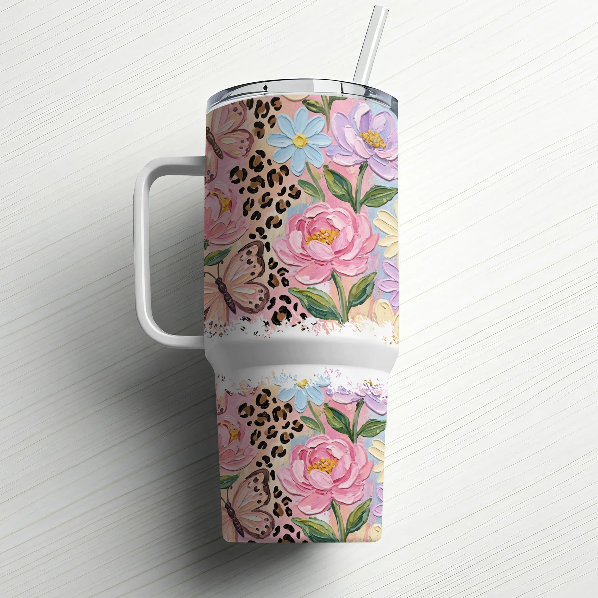 Pink floral and leopard print tumbler with straw.