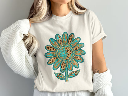 Graphic tee with a turquoise and brown leopard print sunflower design.