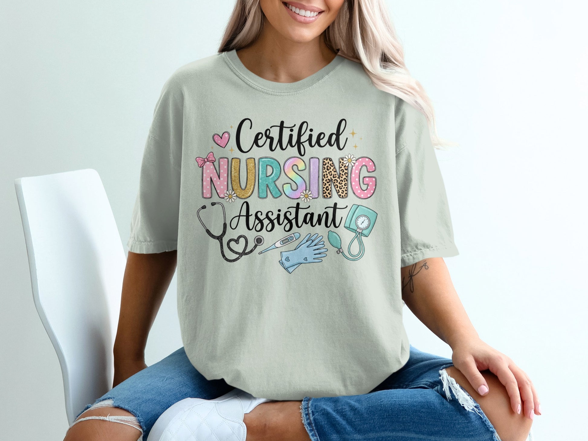 Certified Nursing Assistant text with stethoscope and medical icons on t-shirt.