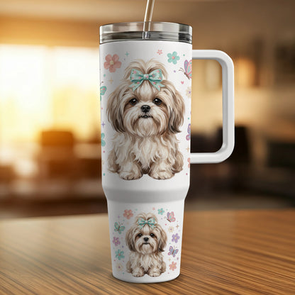 Shih Tzu dog with bow on tumbler with butterflies and flowers.