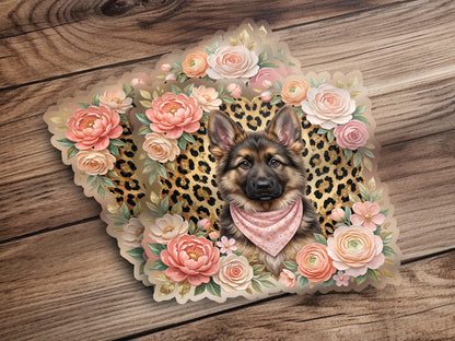 German Shepherd wearing a bandana surrounded by flowers.
