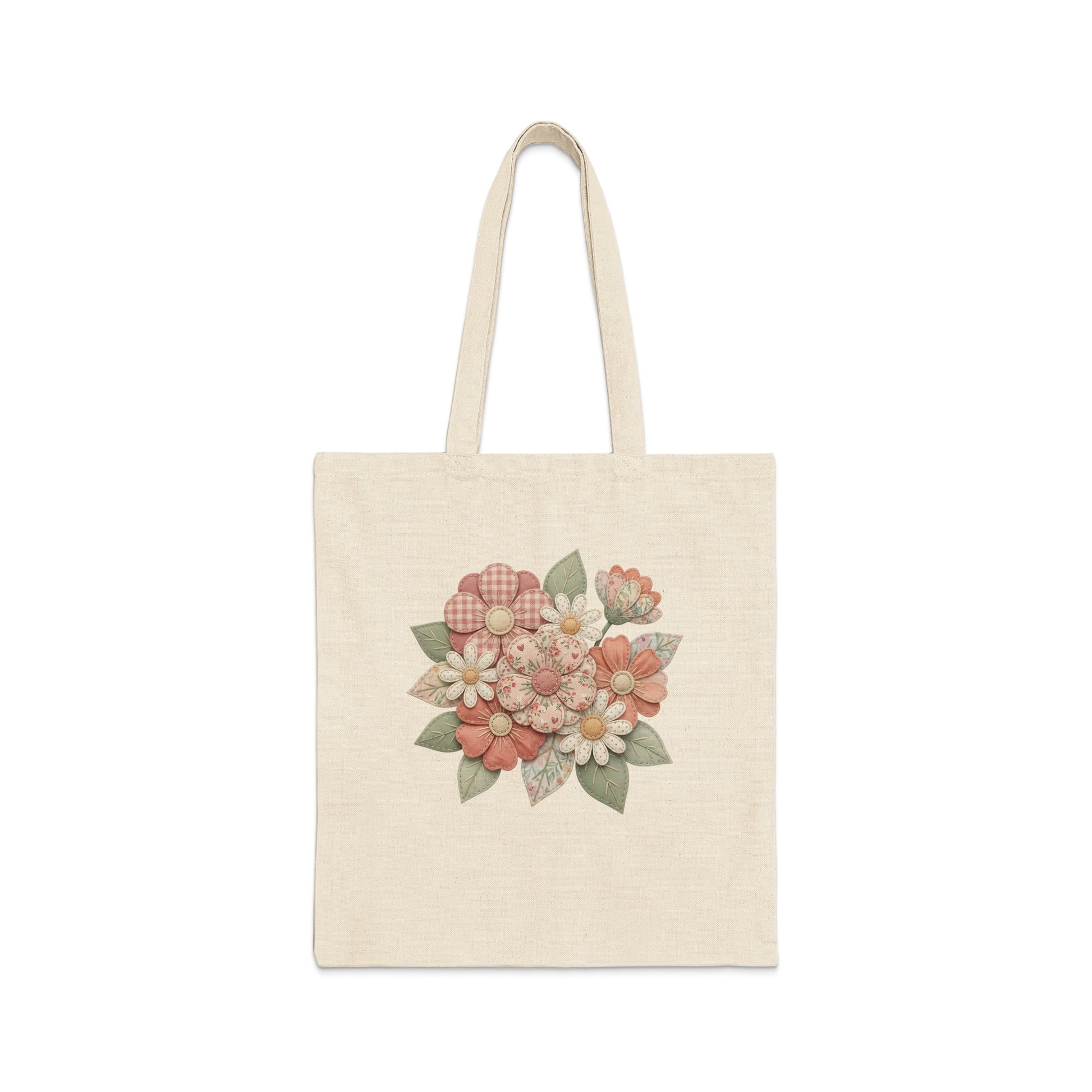 Canvas tote bag with a floral pattern in muted pinks and greens.
