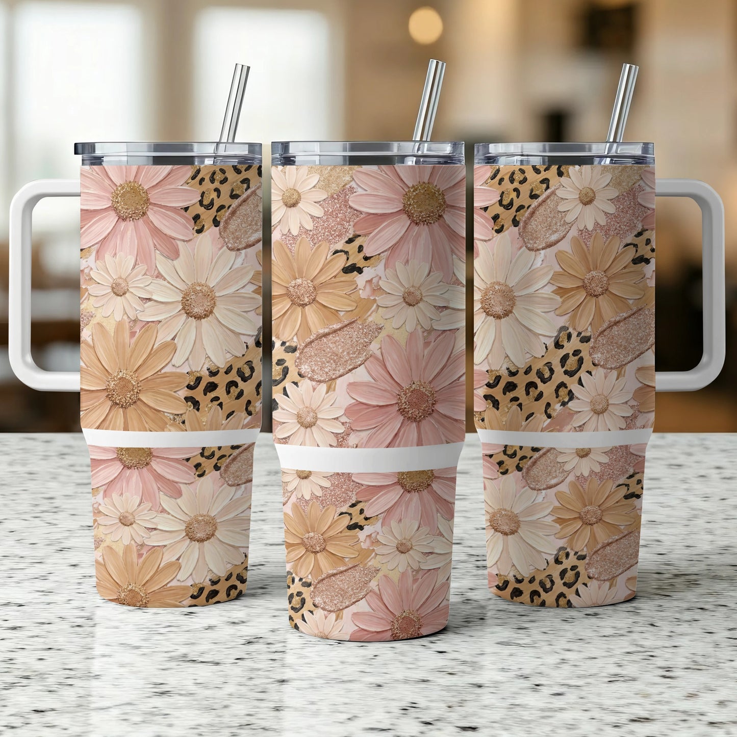 Three tumblers with floral and leopard print designs, featuring handles and straws.