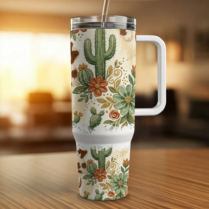 Tumbler with cowboy cactus floral and cow print design.