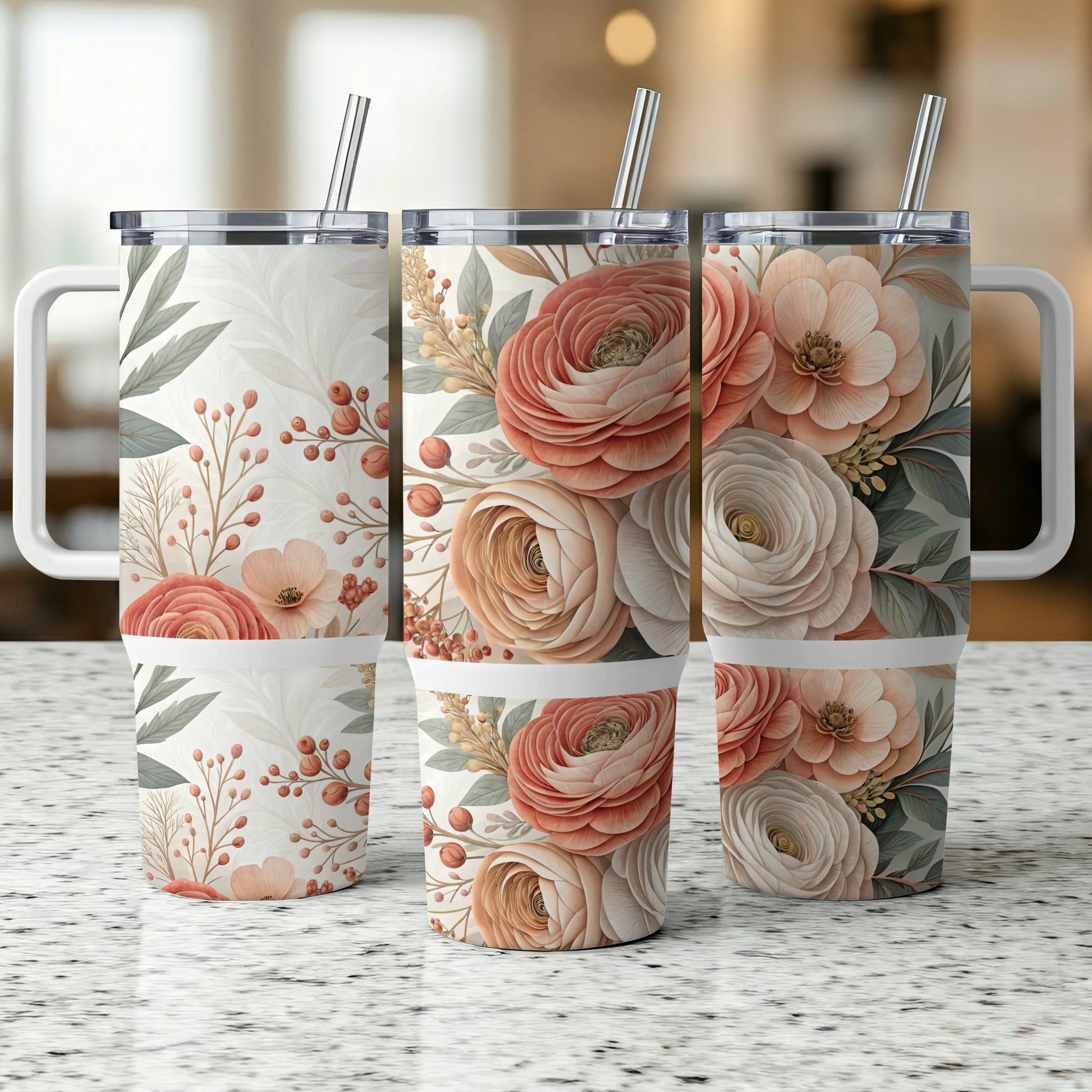 Three insulated tumblers with floral patterns and metal straws.